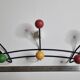 Vintage wall coat rack in black metal and wood, Roger Féraud style from the 1960s.