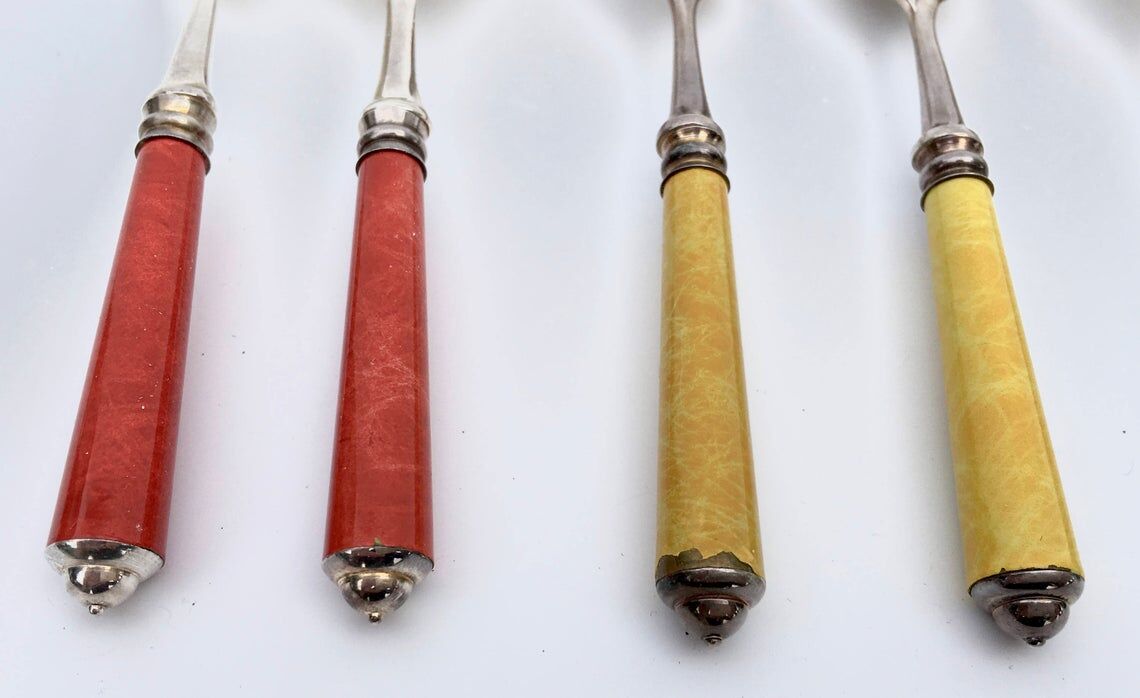 Set of eight enamelled silver spoons