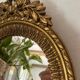 Round golden convex mirror with mouldings - witch's mirror