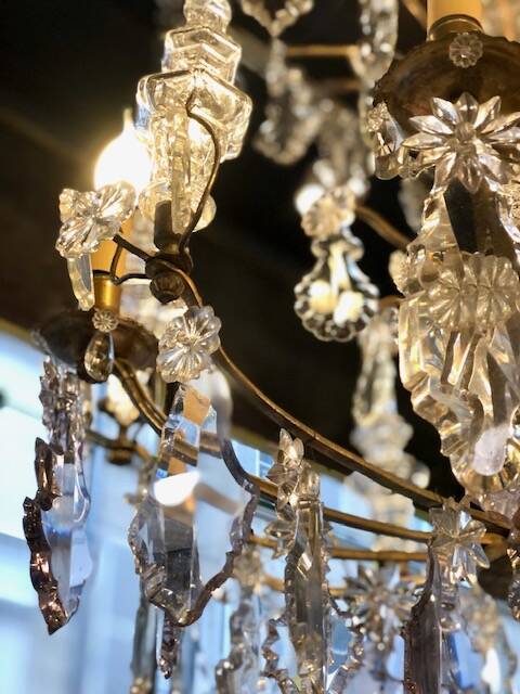 Large chandelier with tassels and old daggers