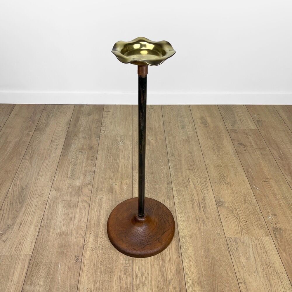 Brass ashtray on metal stand and wooden base