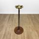 Brass ashtray on metal stand and wooden base