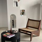 Reclined armchair in canned teak in natural wood