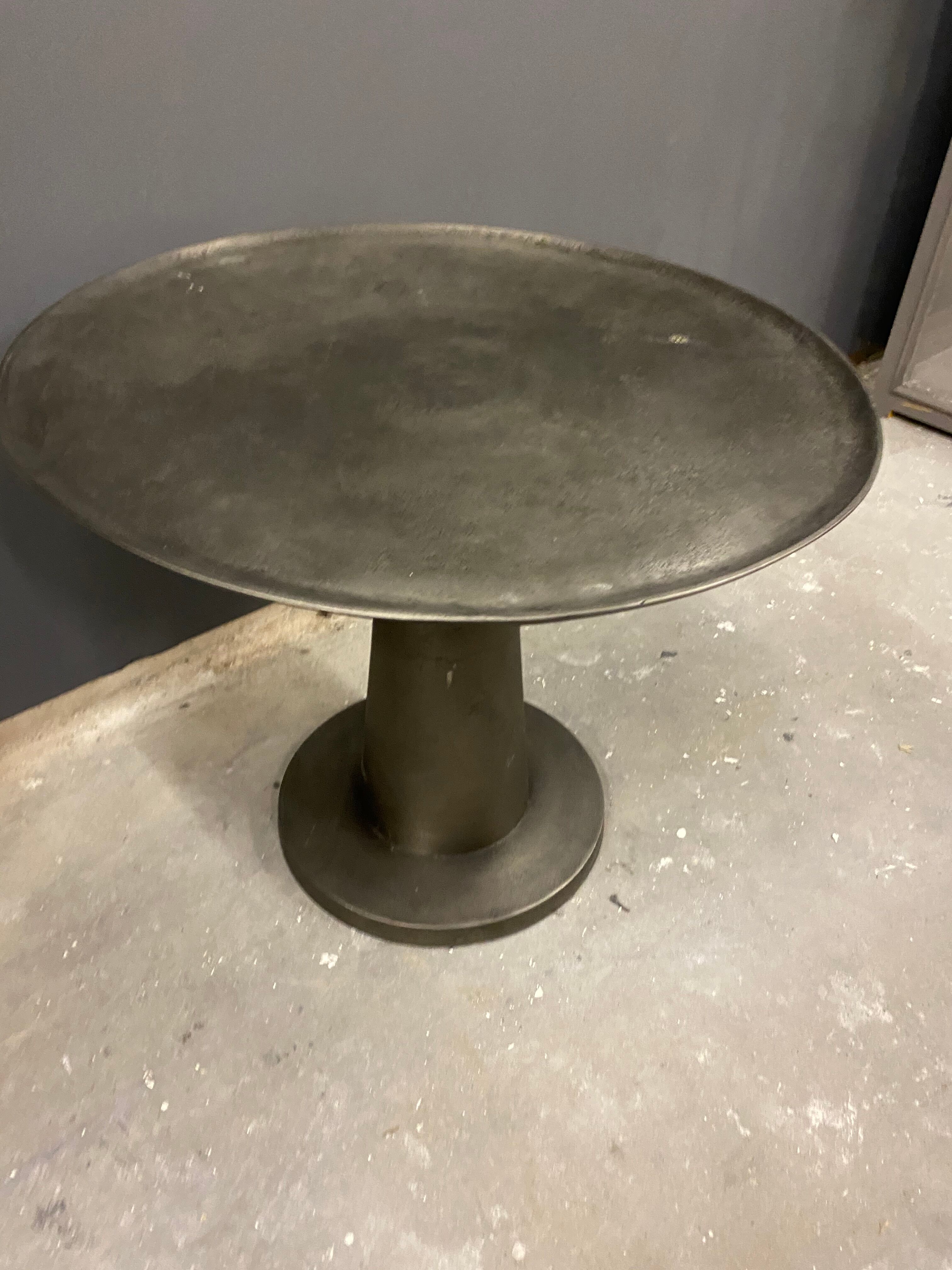 Industrial grey metal round table