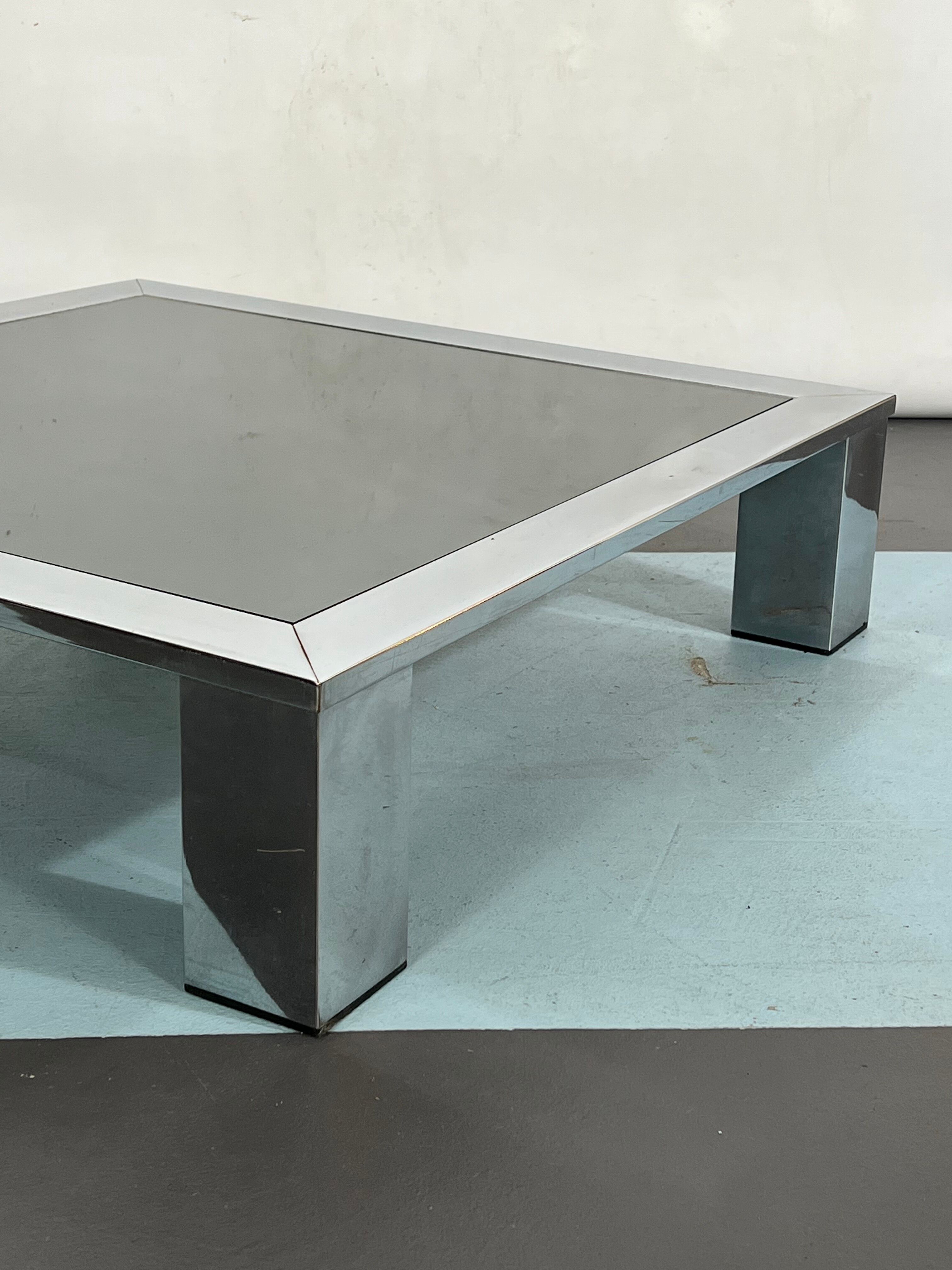 Mid-century chrome and dark mirror glass side table attributed to Saporiti. Italy 1970s