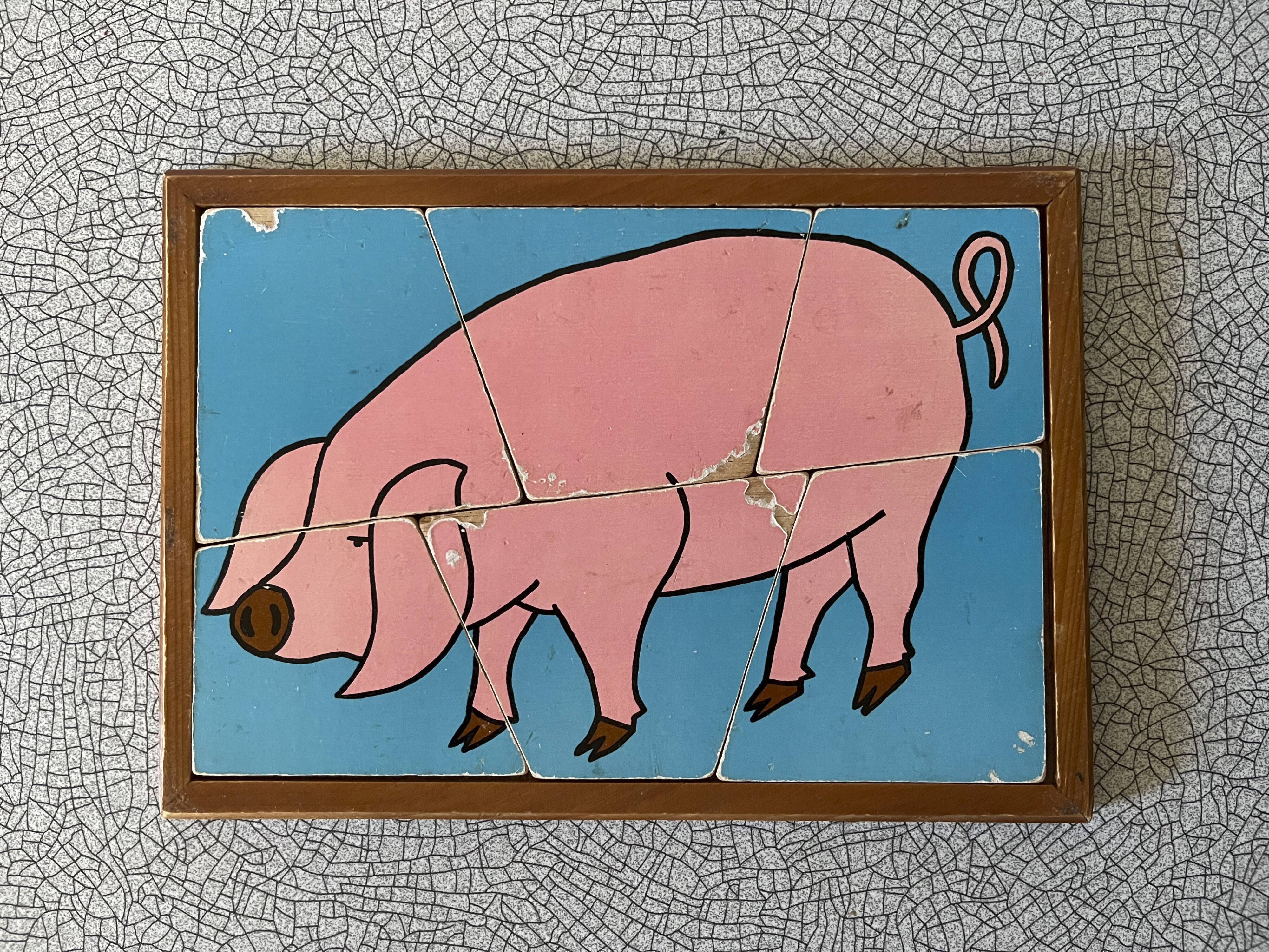 Wooden puzzle frame from the 50s/60s depicting a pink pig
