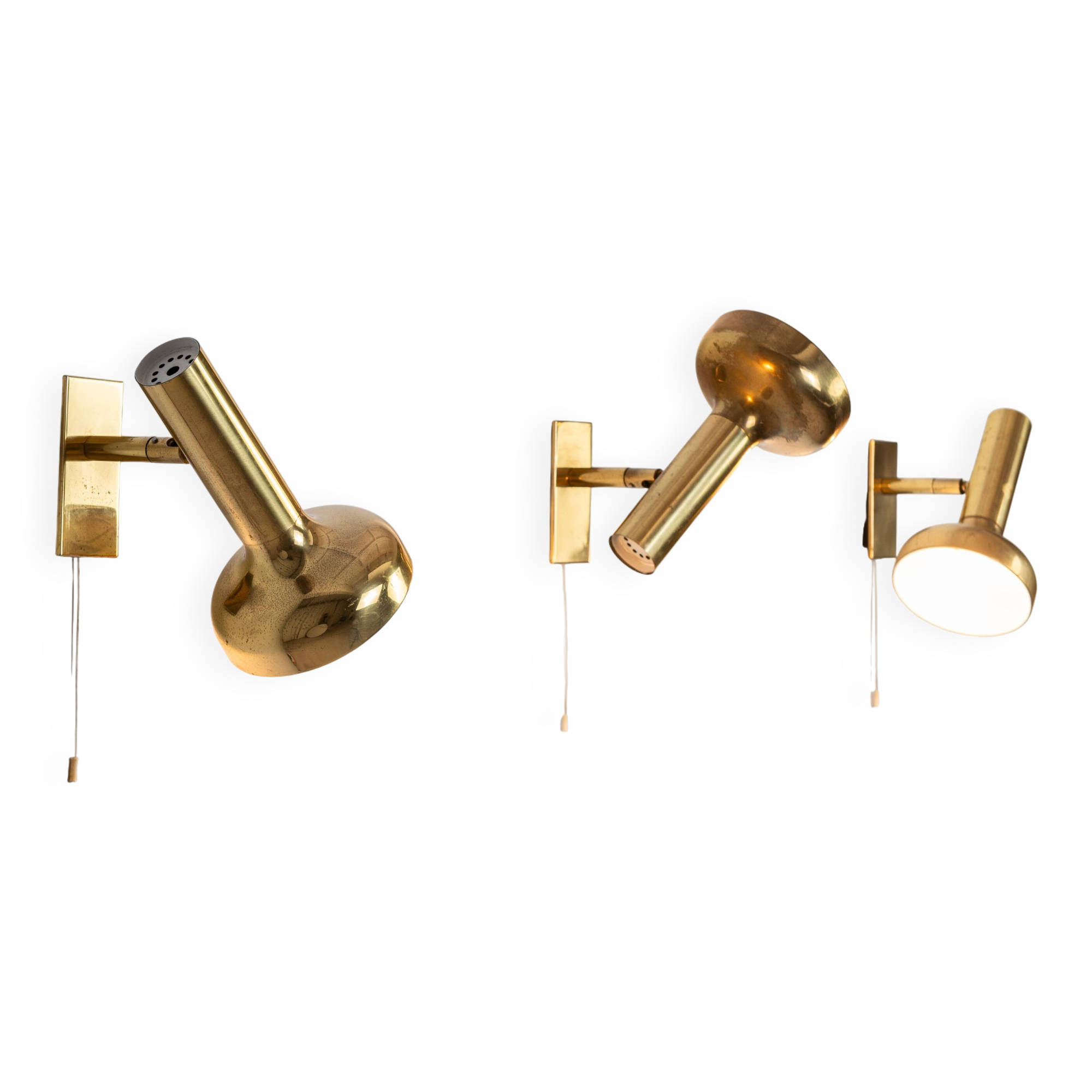 Set of three brass adjustable wall lamps