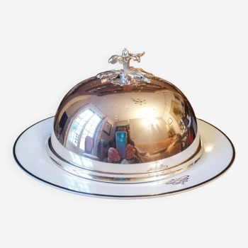 Silver metal bell on its porcelain dish