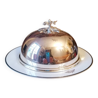 Silver metal bell on its porcelain dish