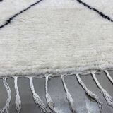 White wool rug with framing