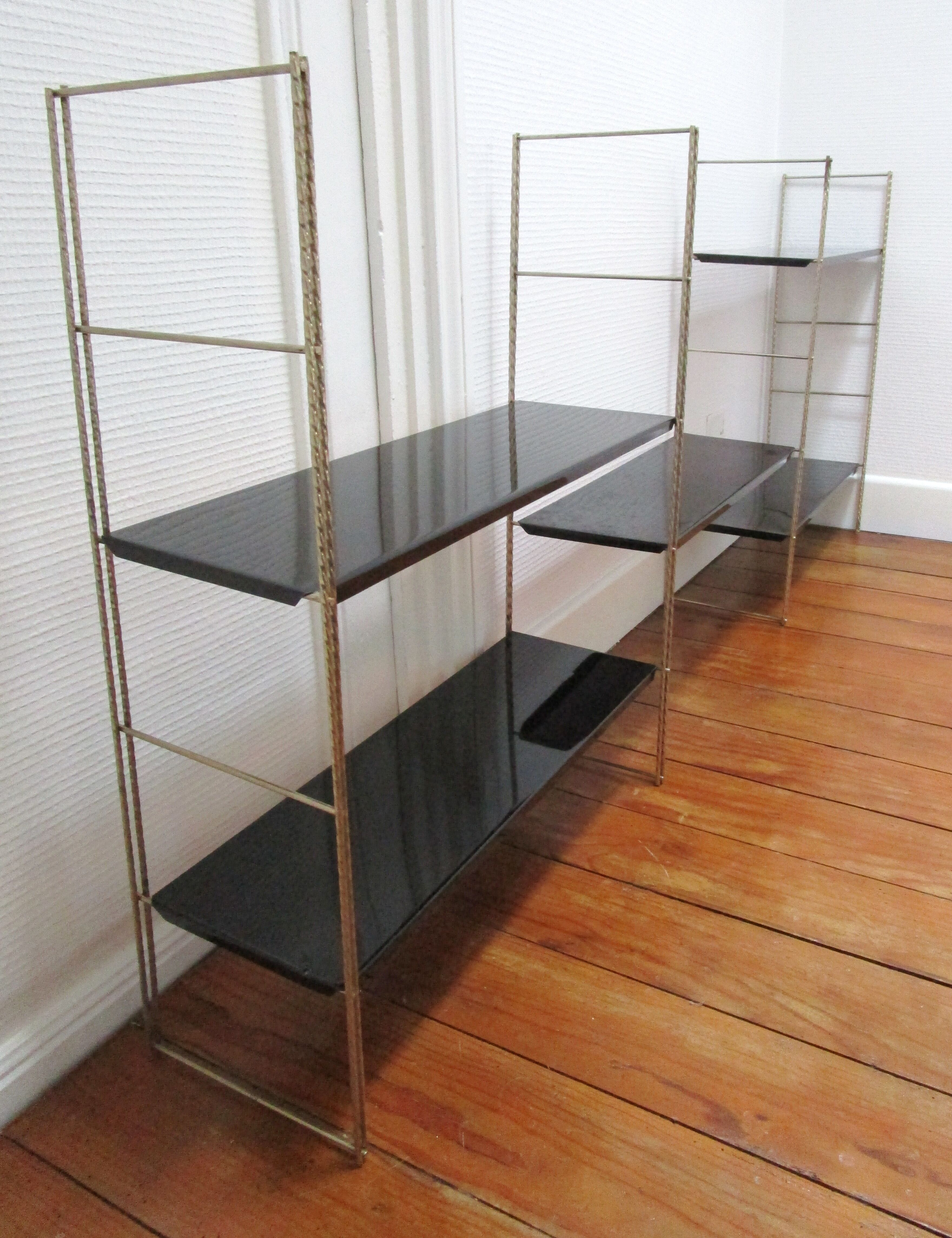 Black and gold metal tomado wall shelf