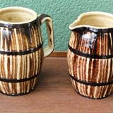Pair of trompe l'oeil bistro pitchers, barrels