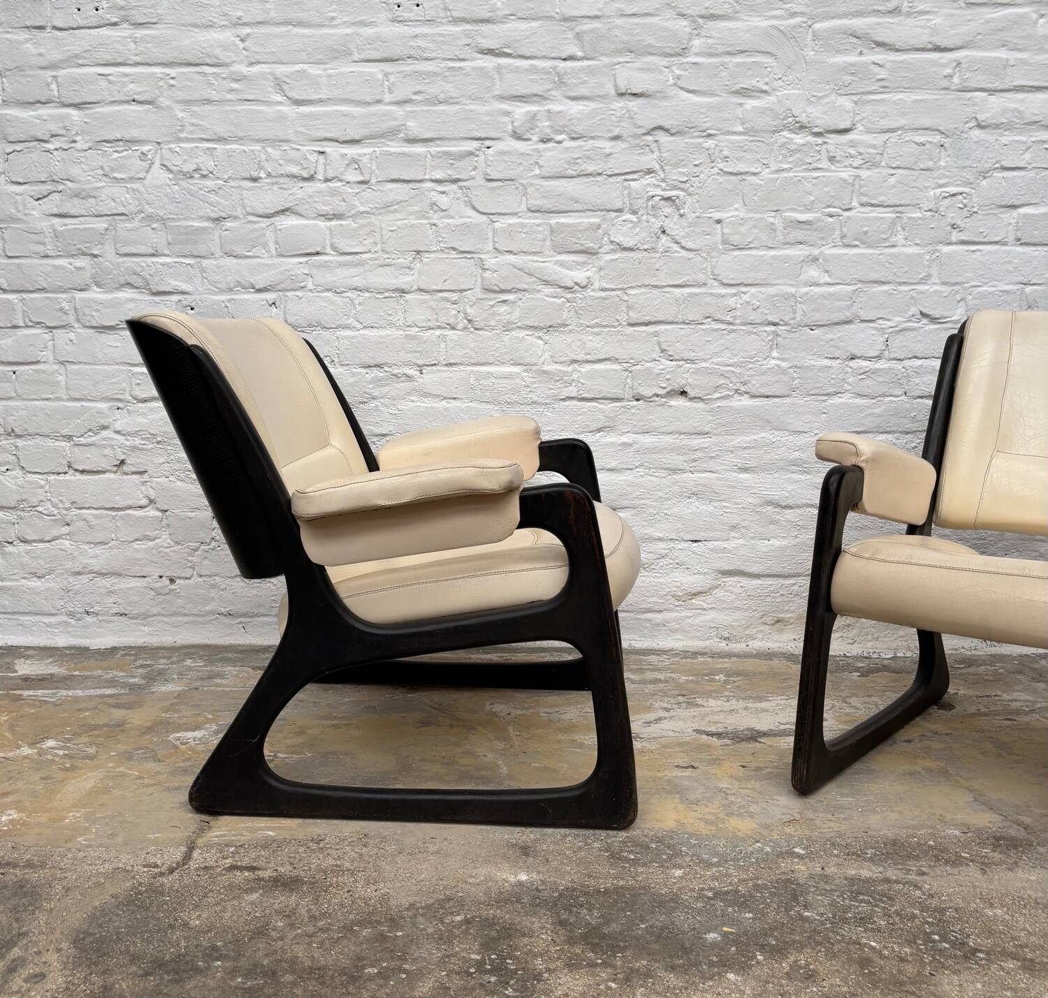 Set of two Baumann sled lounge chairs.