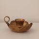 Brass candle holder in the shape of a flower.