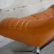 Sofa "space age". Leather, fiberglass, foam, steel. Circa 1970. Orange.