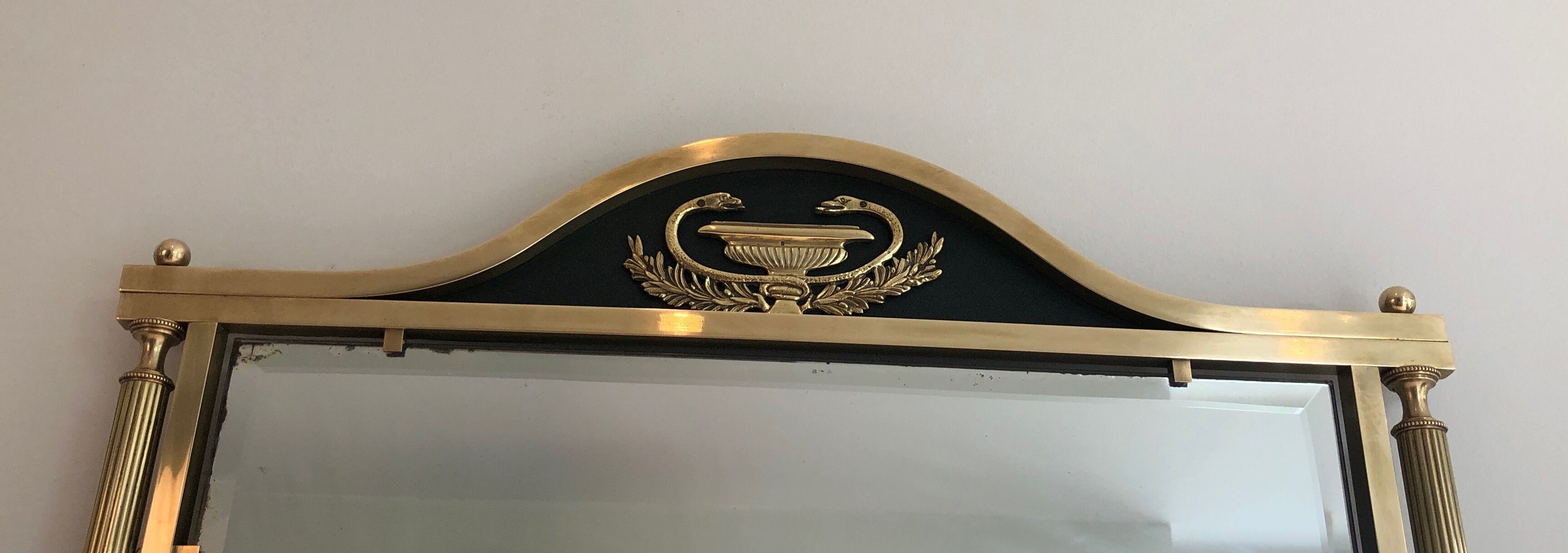 Neoclassical style mirror in brass and lacquered sheet metal