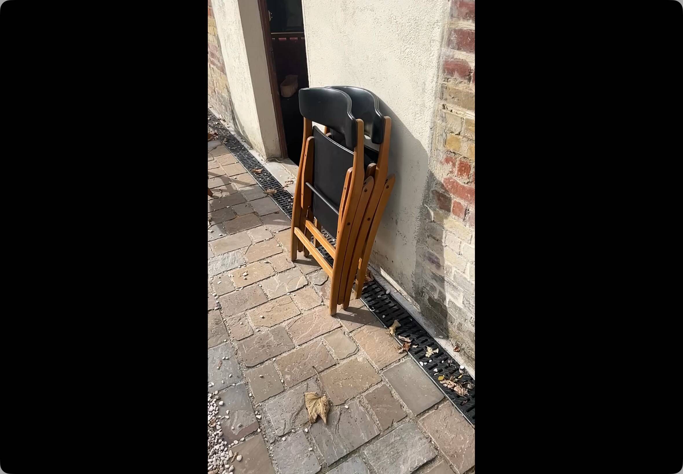 Four black vinyl folding chairs, circa 1960, Scandinavian style, very good condition