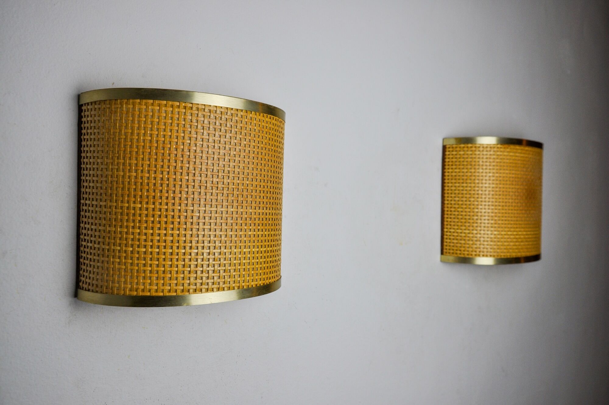 Pair of rattan and brass appliques, Italy, 1960