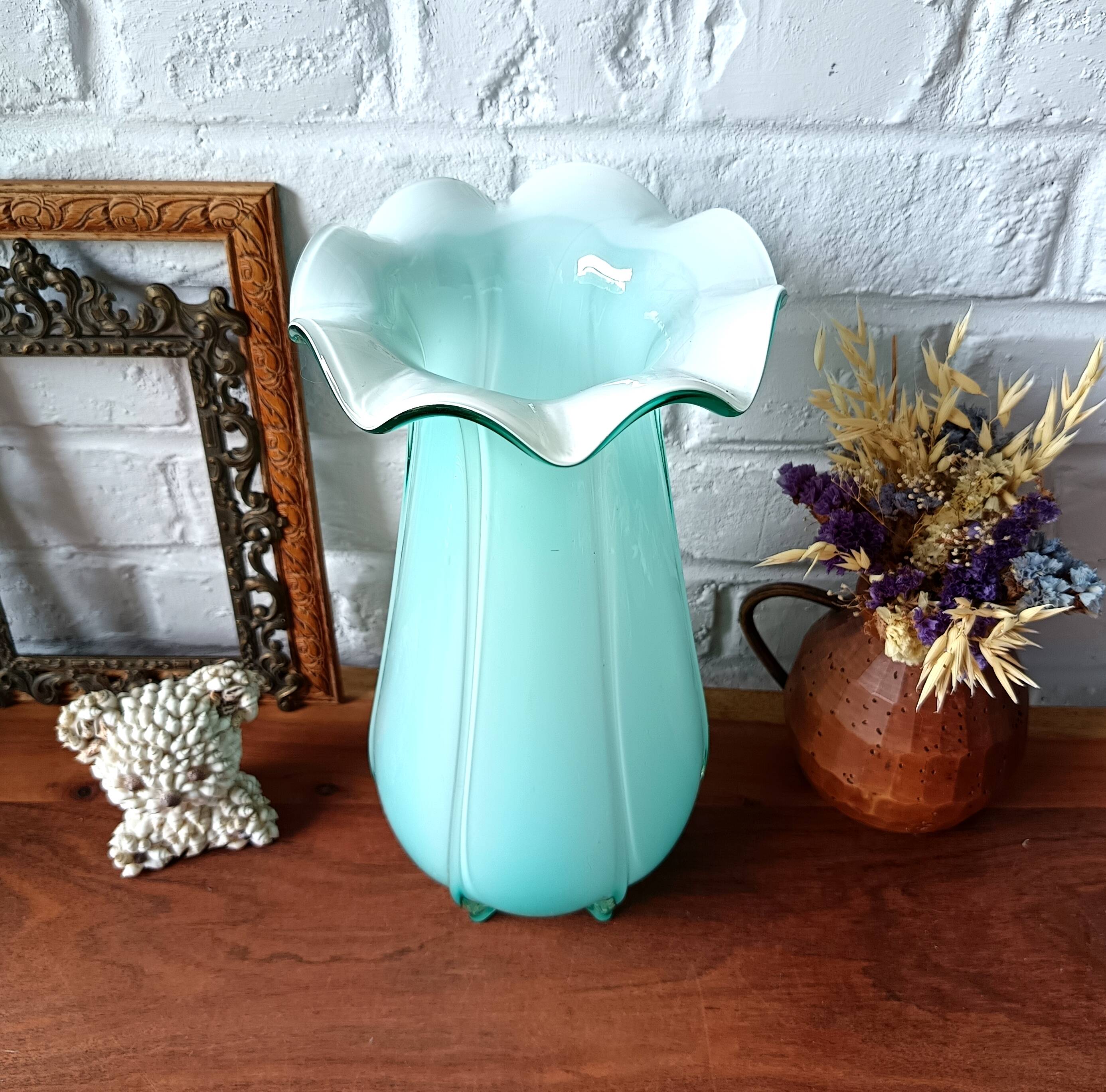 Large light blue opaline vase with a wavy neck.