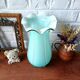Large light blue opaline vase with a wavy neck.