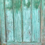 Pair of old wooden shutters green mint color