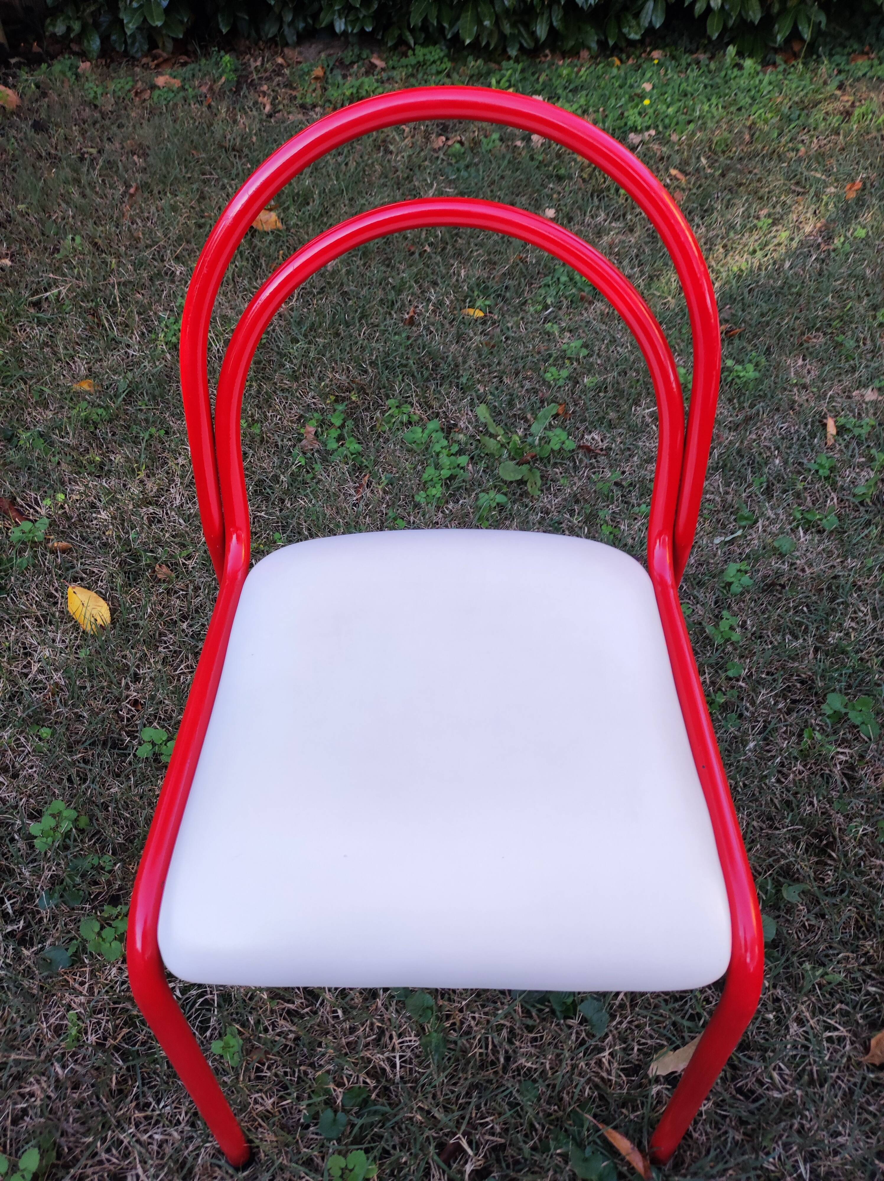 Stackable chairs, Italy, 1980s, red metal, white vinyl