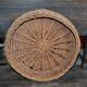 Vintage brown wicker round basket from the 1940s, woven flat, diameter 37 cm.
