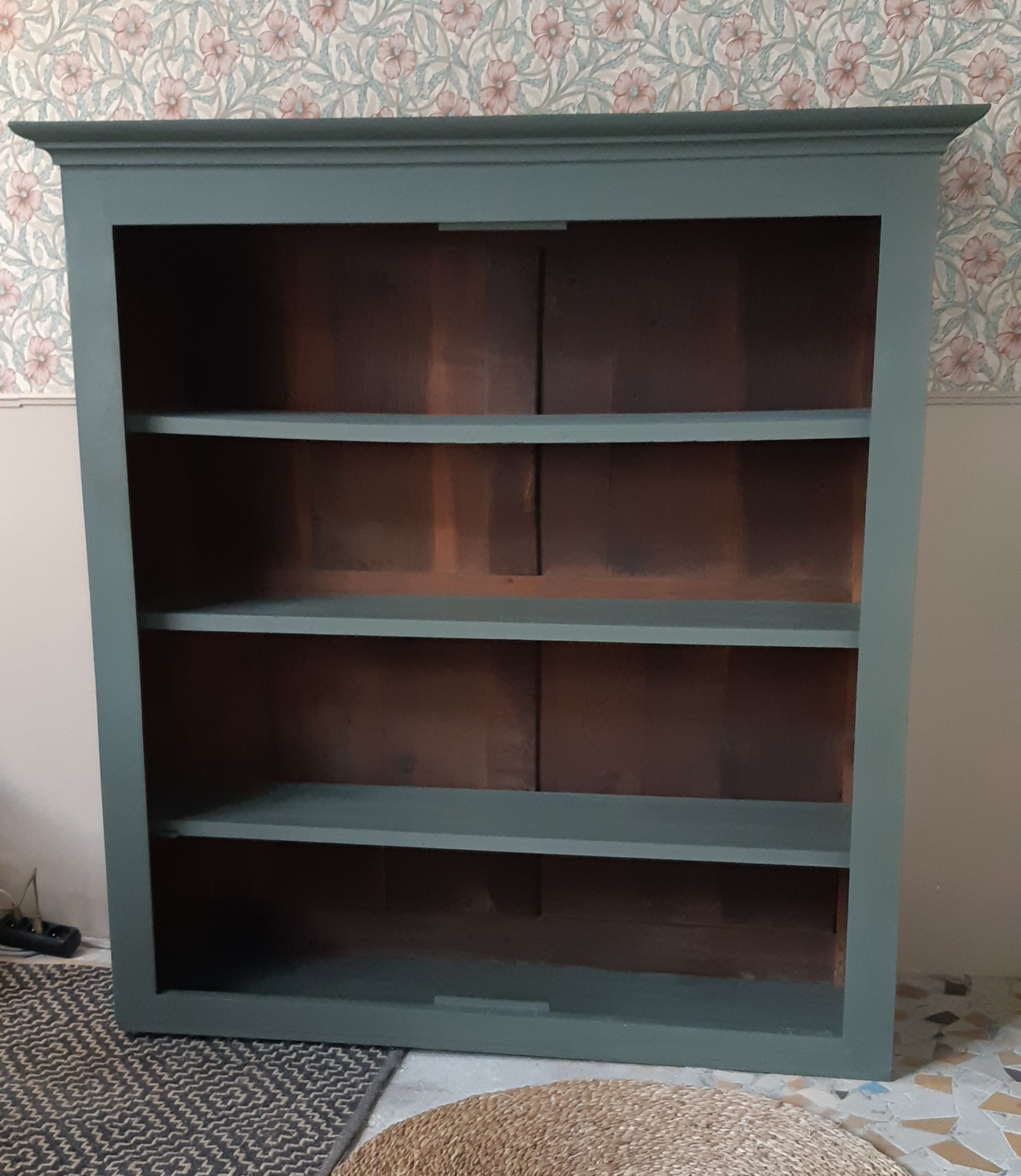 Wood and khaki green bookcase