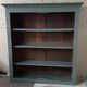 Wood and khaki green bookcase