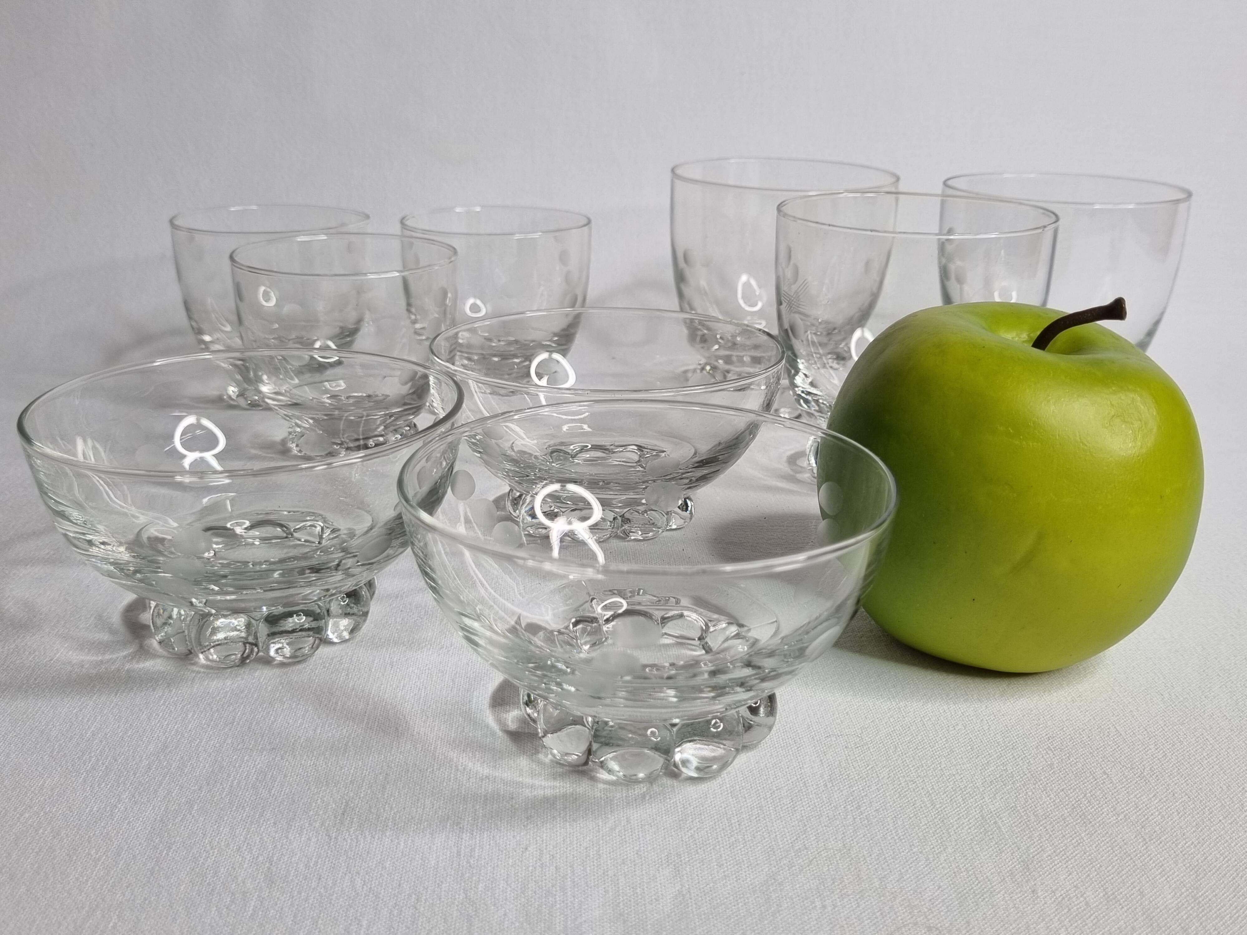 Set of Art Deco style engraved crystal bowls and glasses on spherical feet