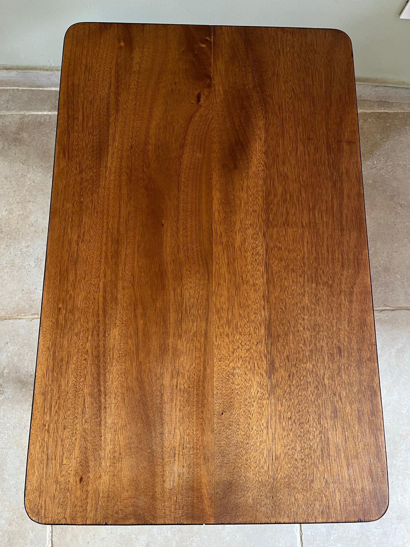 Mid-century coffee table with tapered legs.