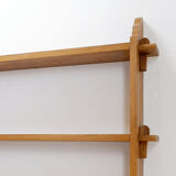 Wall shelves with dowels in Arts & Crafts style