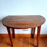 Antique round walnut table with flaps