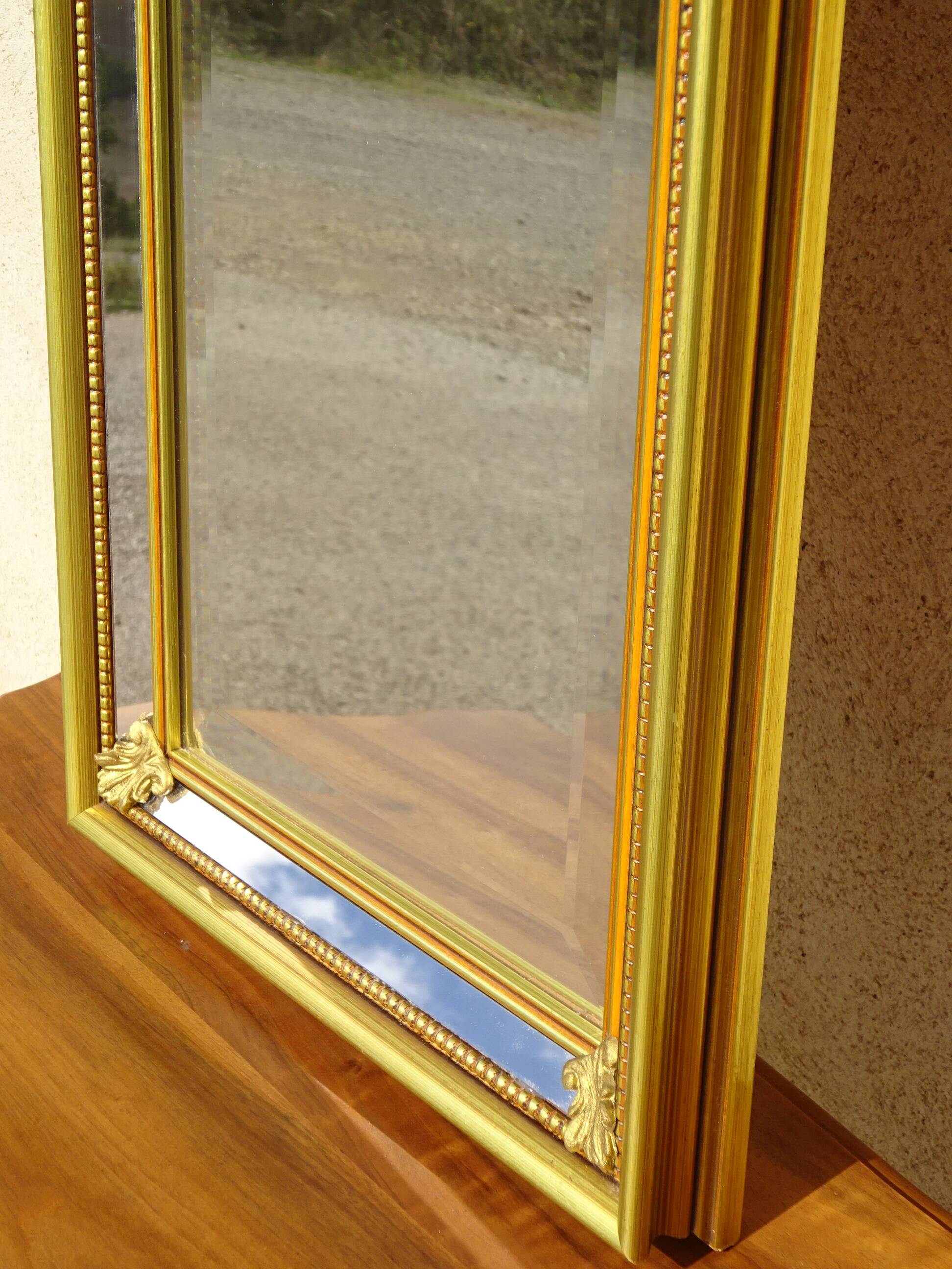 Hallway mirror, gilded frame, curtains and fleur-de-lis