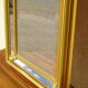 Hallway mirror, gilded frame, curtains and fleur-de-lis