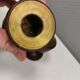 Two beautiful teak candle holders with brass inserts.
