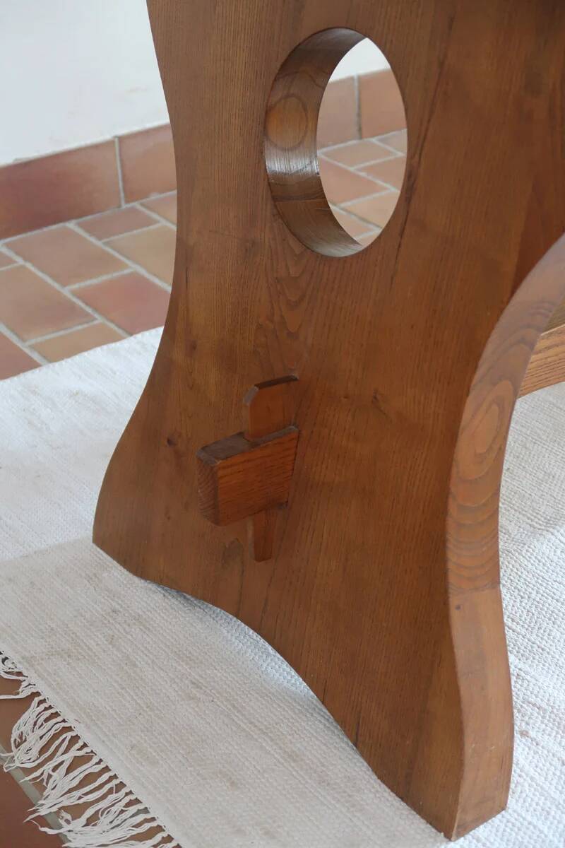 Solid wood dining table, sculpted brutalist base, 1960s.
