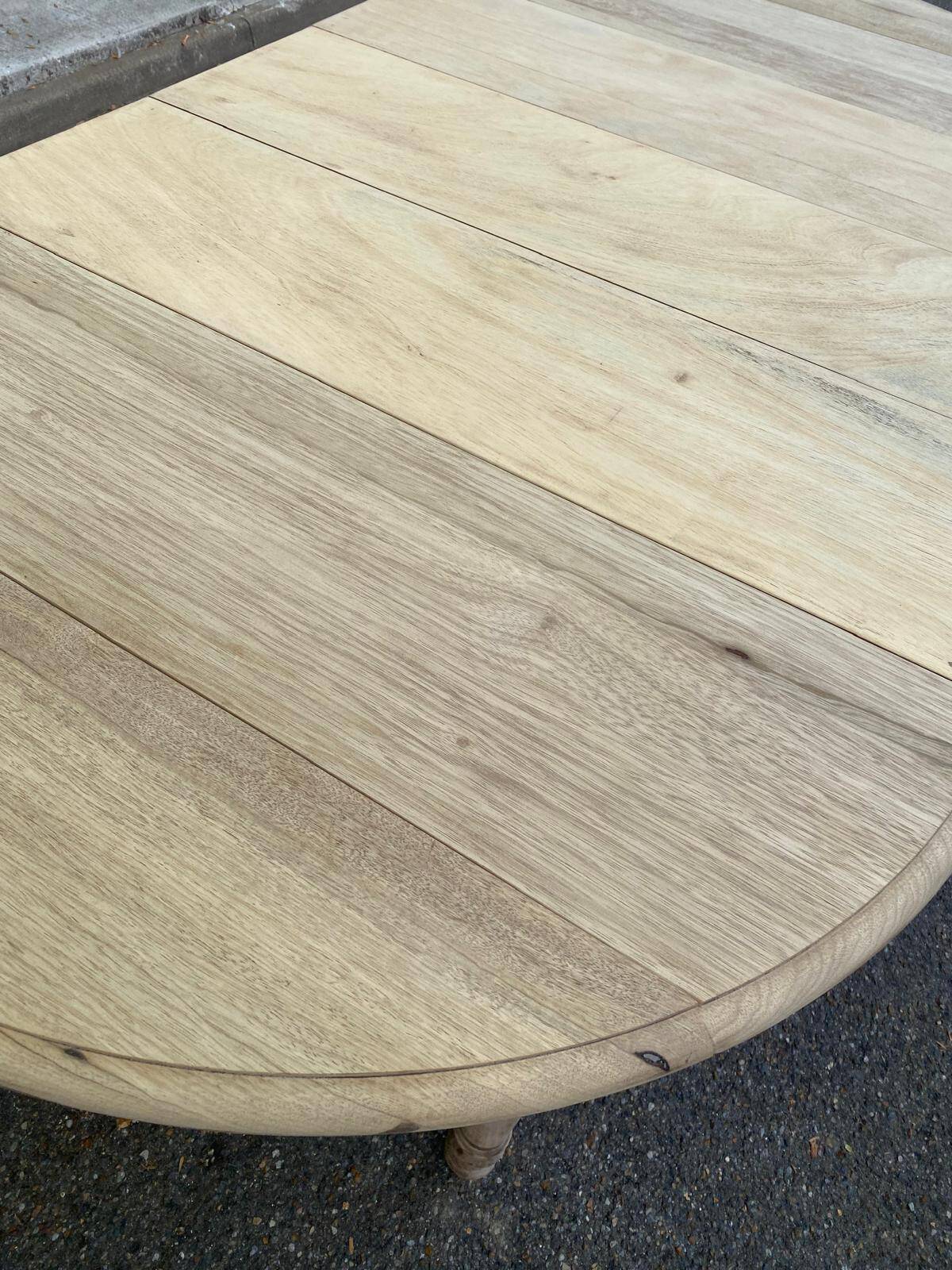 Round extendable dining table with flaps, stripped in raw oak, with 3 extensions.