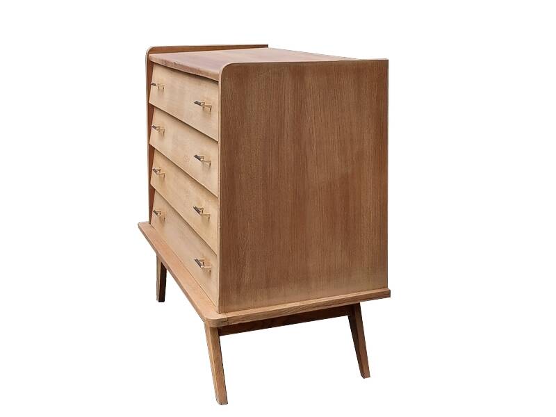 Renovated vintage commode from the 1960s in oak with slanted profile and tapered legs.