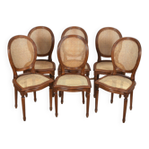 Medallion chairs in canework, carved wood.