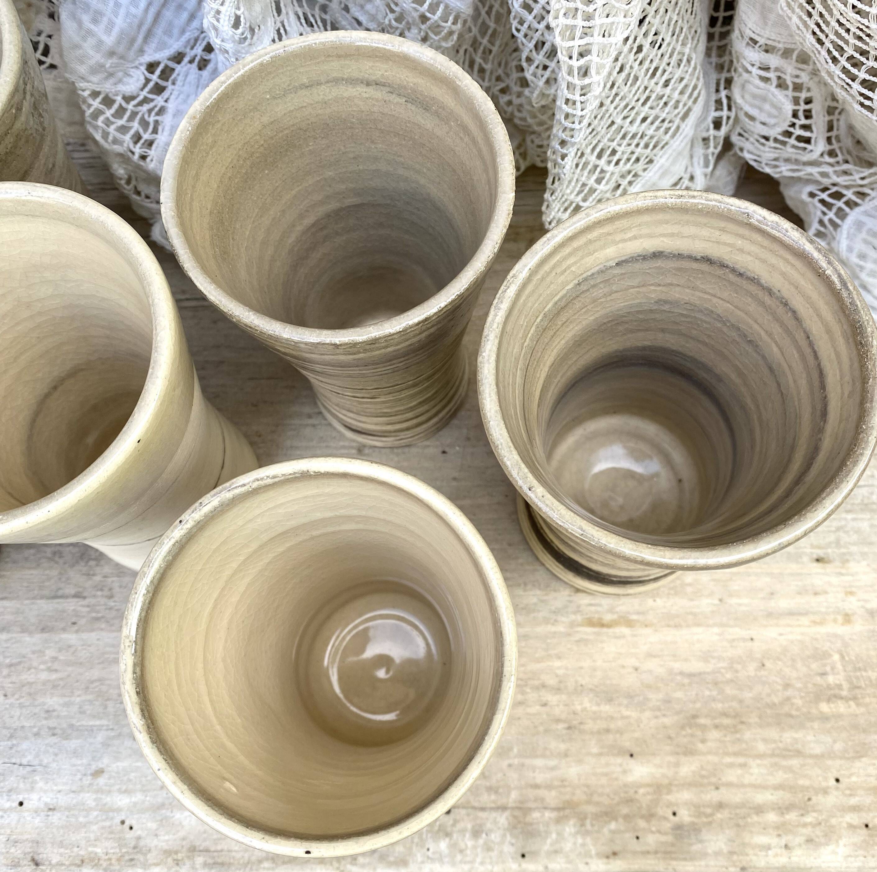 High ceramic cups made of mixed clay.