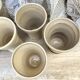 High ceramic cups made of mixed clay.