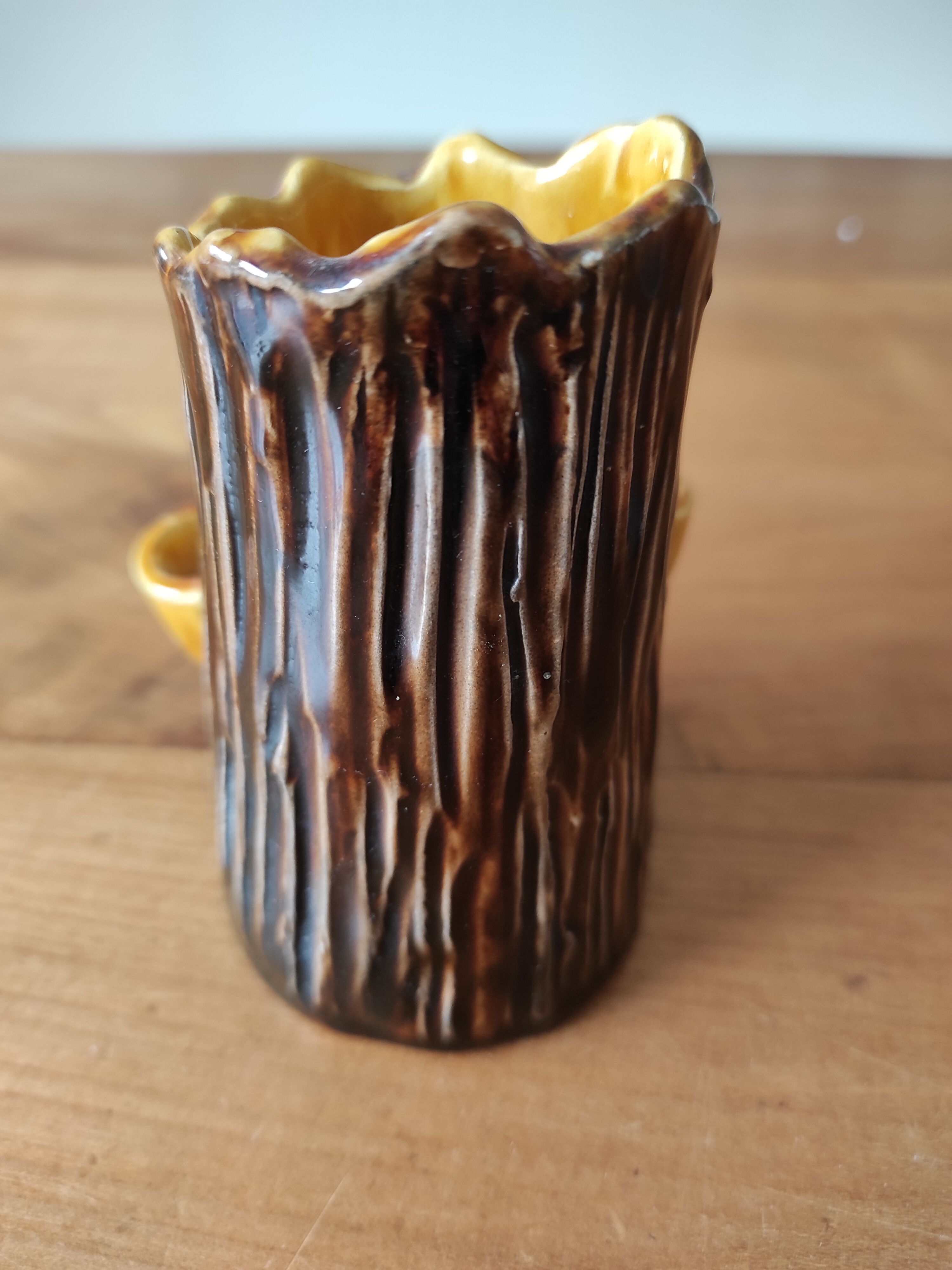 Ceramic vase with tree trunk decoration