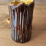Ceramic vase with tree trunk decoration
