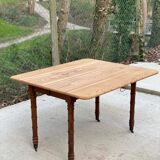 Louis Philippe 19th century square table with shutters in solid oak wood on casters