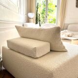 Square ottoman and its cushions in buckle fabric