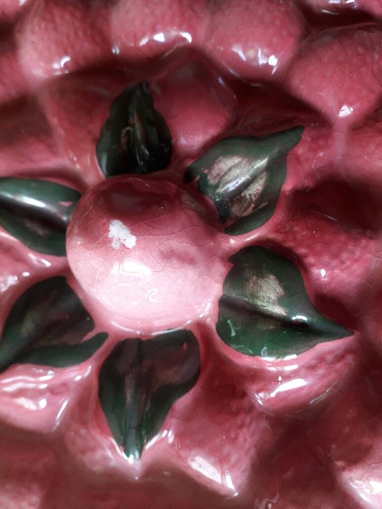 Glazed ceramic dessert plate with strawberry design.