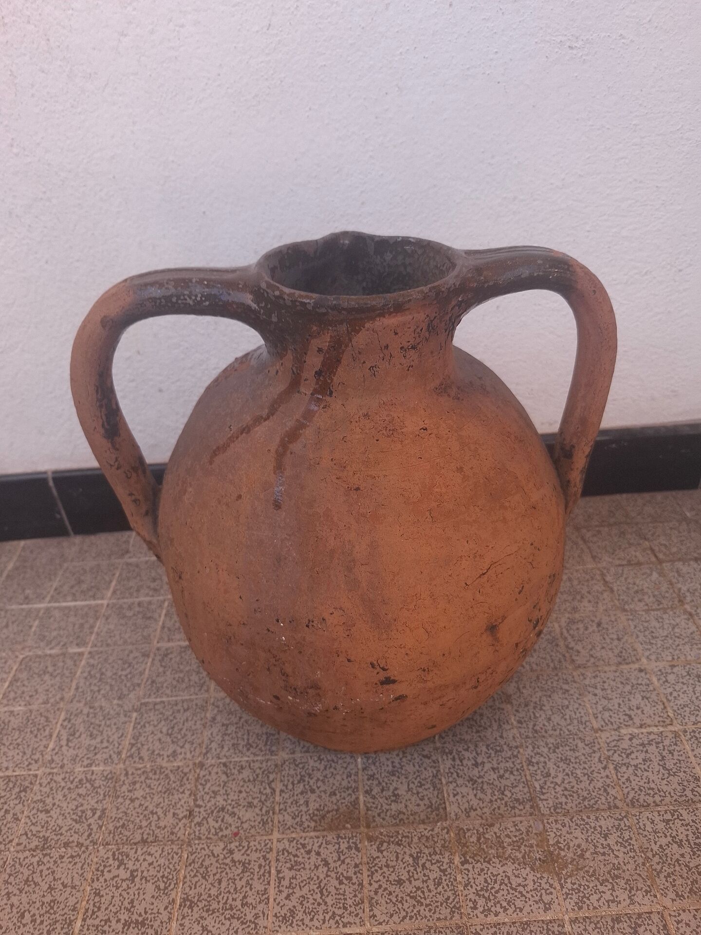 Jug, I stop at glazed terracotta oil.