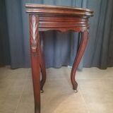 Half-moon mahogany game table on casters