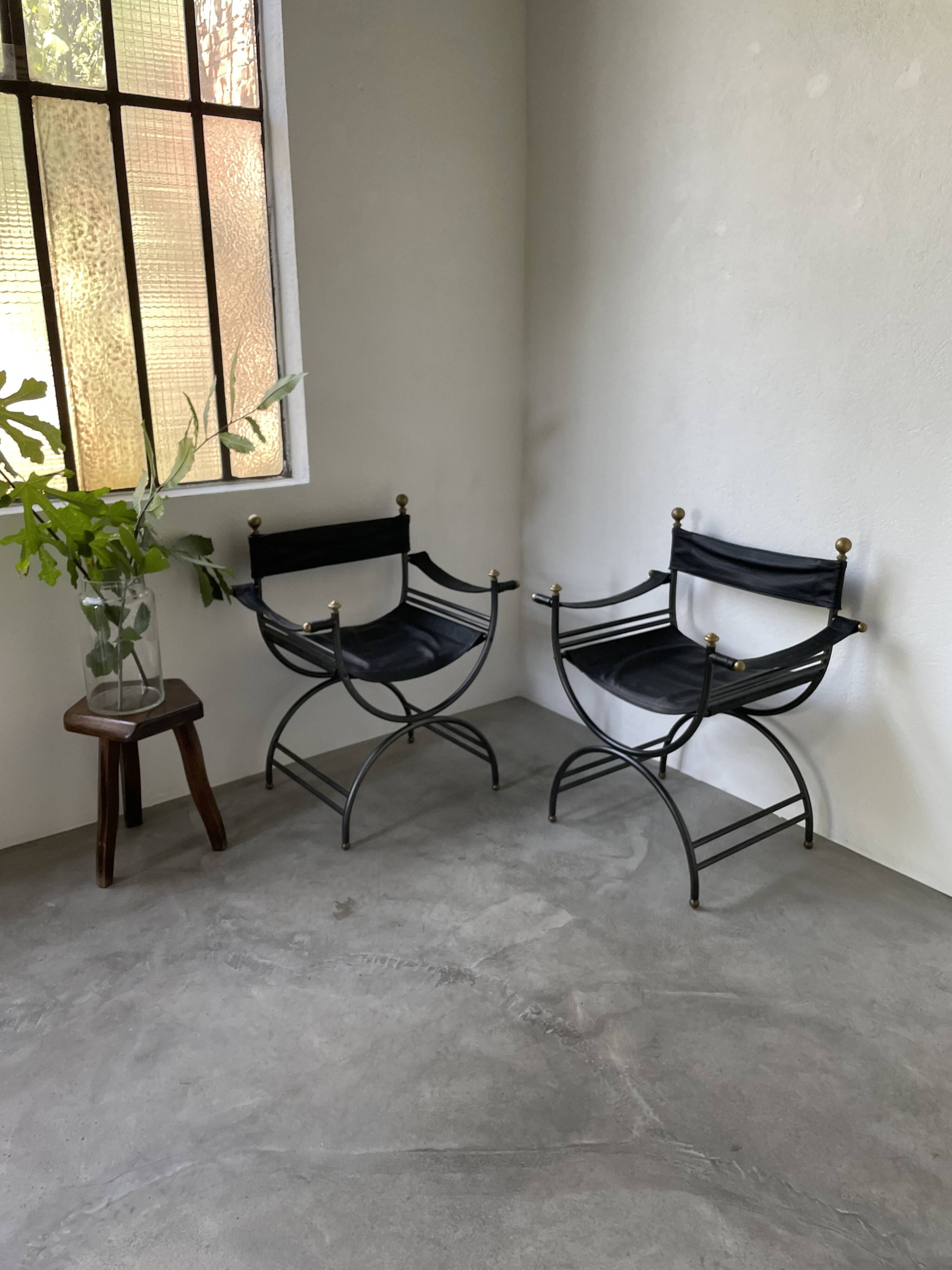 Pair of leather “curule” emperor armchairs